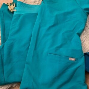 Figs jogger and and shirt scrub set in a teal blue color, size large